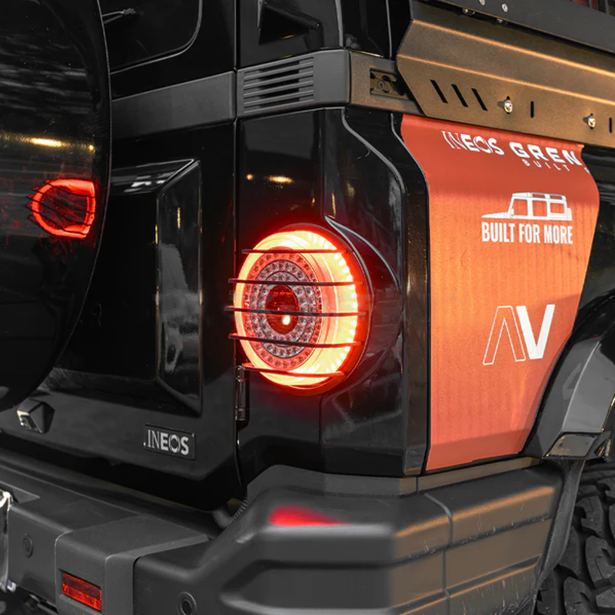 Rear view of Ineos Grenadier fitted with off-road taillight guards, offering reliable protection while maintaining a rugged factory appearance.