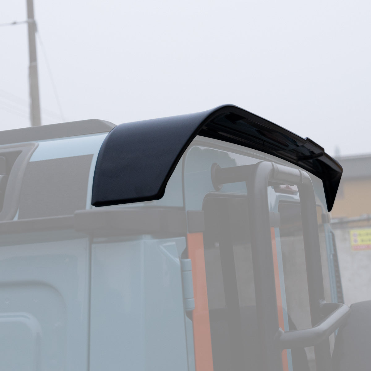 PLOMOR Rear Roof Spoiler perfectly installed on the INEOS Grenadier rear edge, providing a clean, factory-style look.