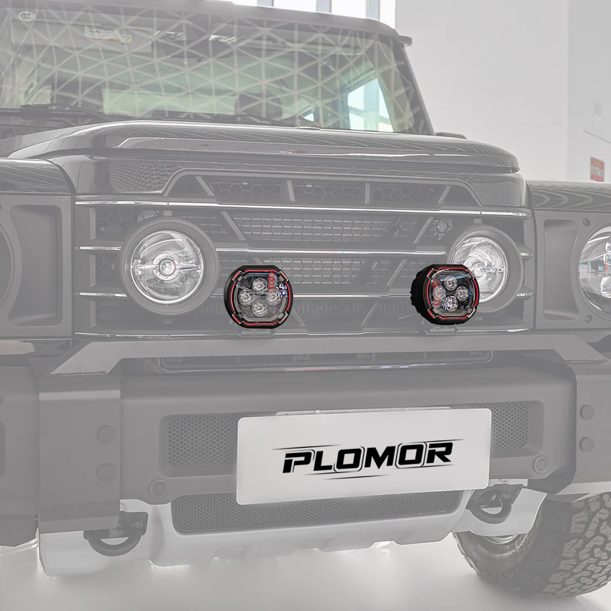 Close-up of dual-function round LED spotlight for INEOS Grenadier showing amber halo ring and LED projector