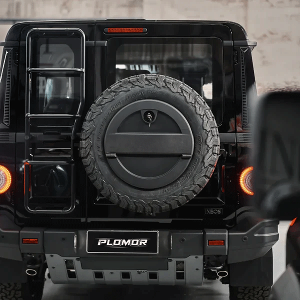 Ineos Grenadier equipped with spare wheel storage box during off road driving scenario