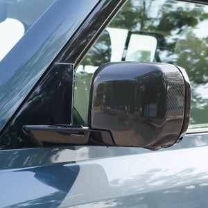 Aerial view of Land Rover Defender with PLOMOR Carbon Fiber Mirror Covers