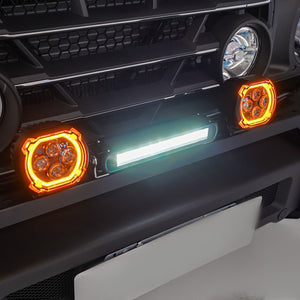 PLOMOR dual-function round LED spotlights for Ineos Grenadier. Features a bright white beam and an amber halo ring for use as DRL or turn signal.