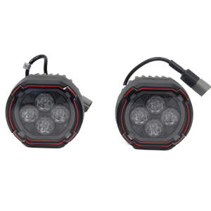 PLOMOR dual-function round LED spotlights for Ineos Grenadier. Features a bright white beam and an amber halo ring for use as DRL or turn signal.