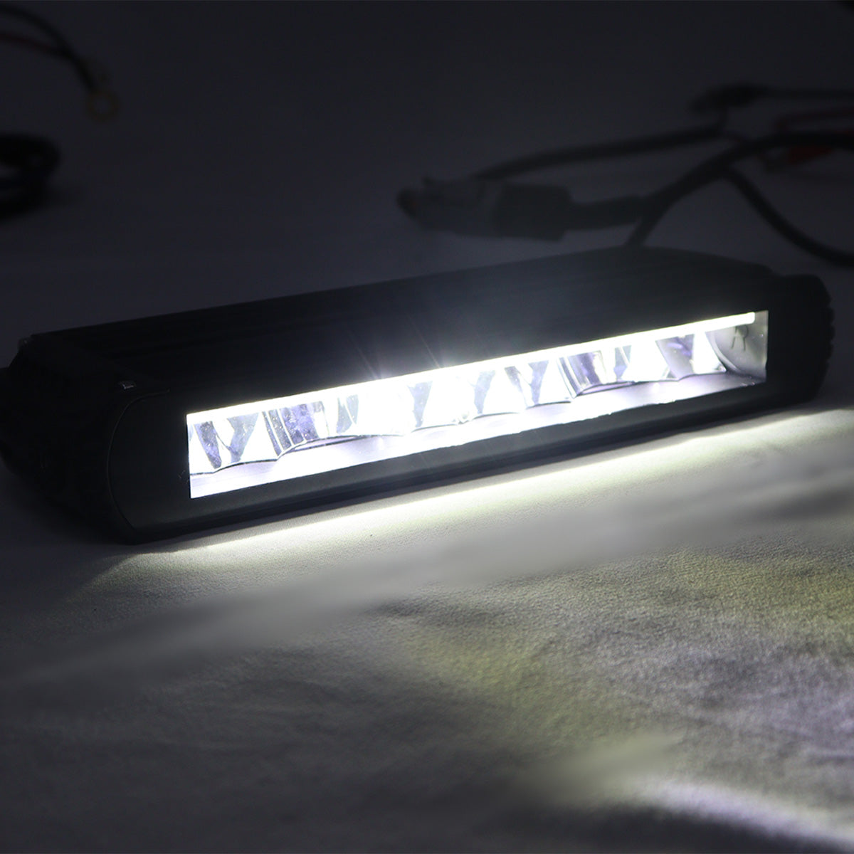PLOMOR slimline LED light bar for Ineos Grenadier. Features durable aluminum housing and dual-mode white/amber illumination for auxiliary and signaling use.
