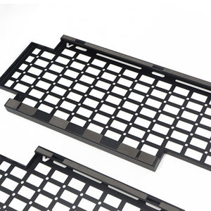 PLOMOR heavy-duty steel body side utility panel for Ineos Grenadier. Features a MOLLE grid system for mounting exterior overlanding and recovery gear.