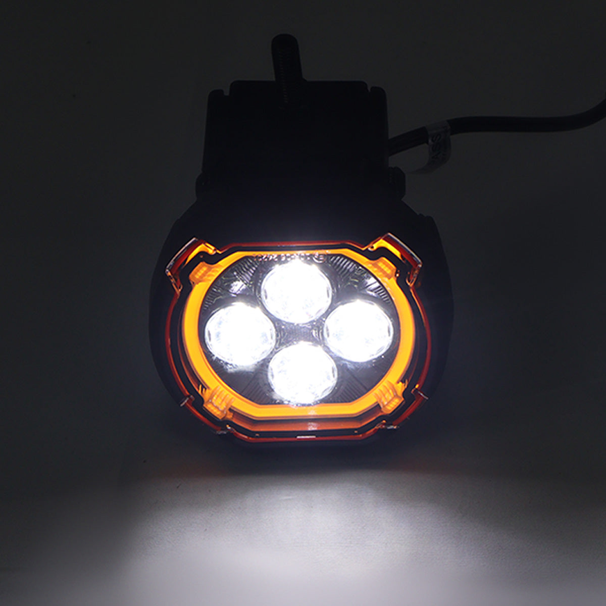 PLOMOR dual-function round LED spotlights for Ineos Grenadier. Features a powerful white beam and an amber halo DRL/turn signal in a custom, plug-and-play design