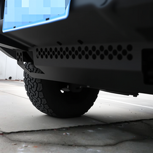 PLOMOR heavy-duty steel front skid plate for INEOS Grenadier. Provides robust undercarriage protection for the engine and differential during off-road use.