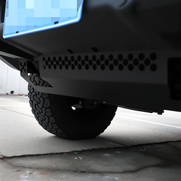 PLOMOR heavy-duty steel front skid plate for INEOS Grenadier. Provides robust undercarriage protection for the engine and differential during off-road use.