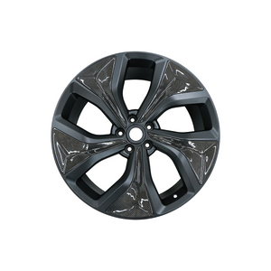 Close-up view of the forged alloy wheel for Range Rover Sport L461, highlighting the precision of the carbon fibre detailing and lightweight construction.