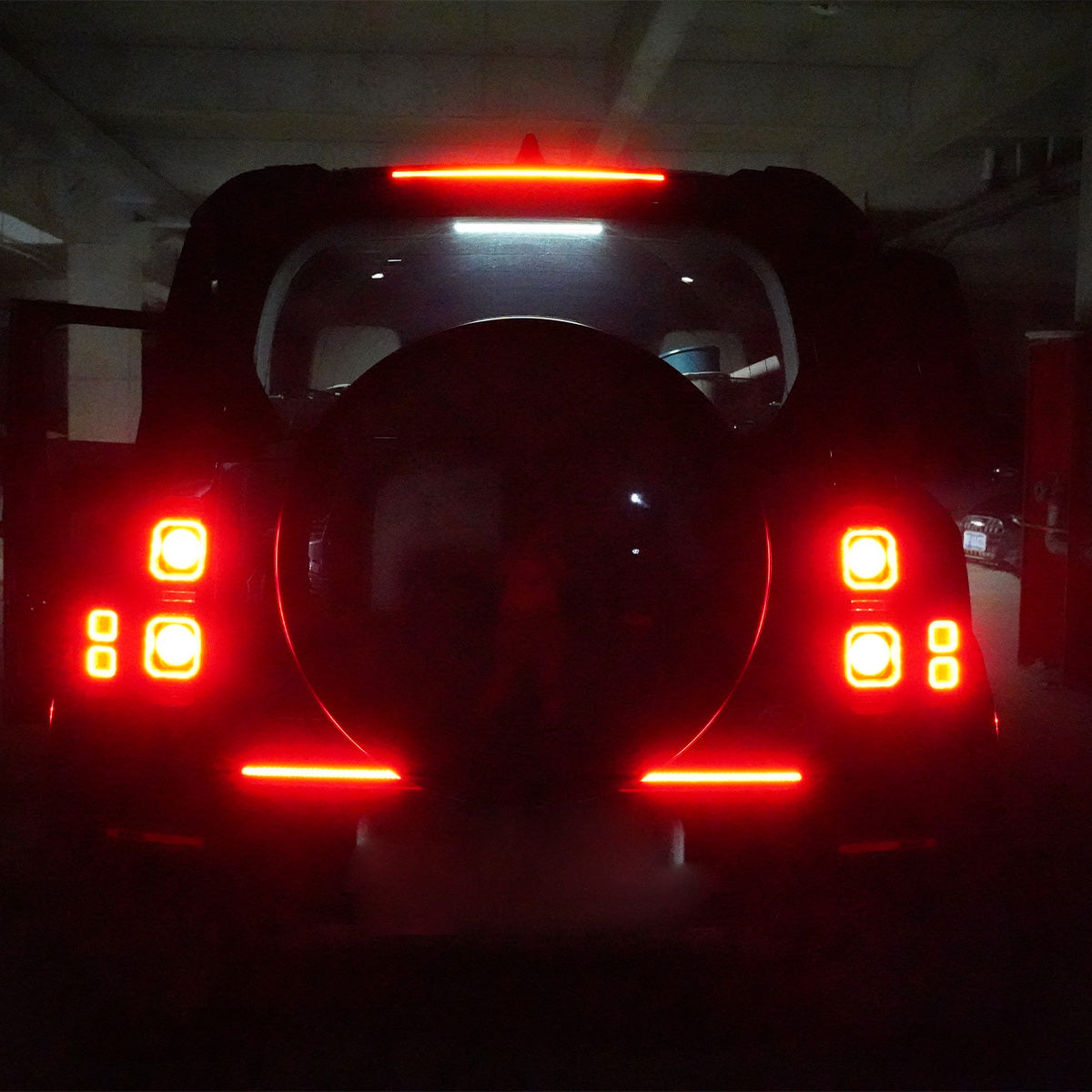 Top-angle view of installed rear tailgate LED light bar on Land Rover Defender 90/110 (L663)