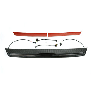 Side view showing full-width carbon-style rear tailgate LED light bar for Defender 90/110 (L663)