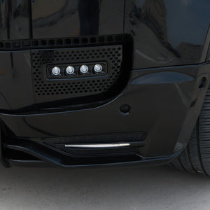 LED front lip splitter installed night view on Defender