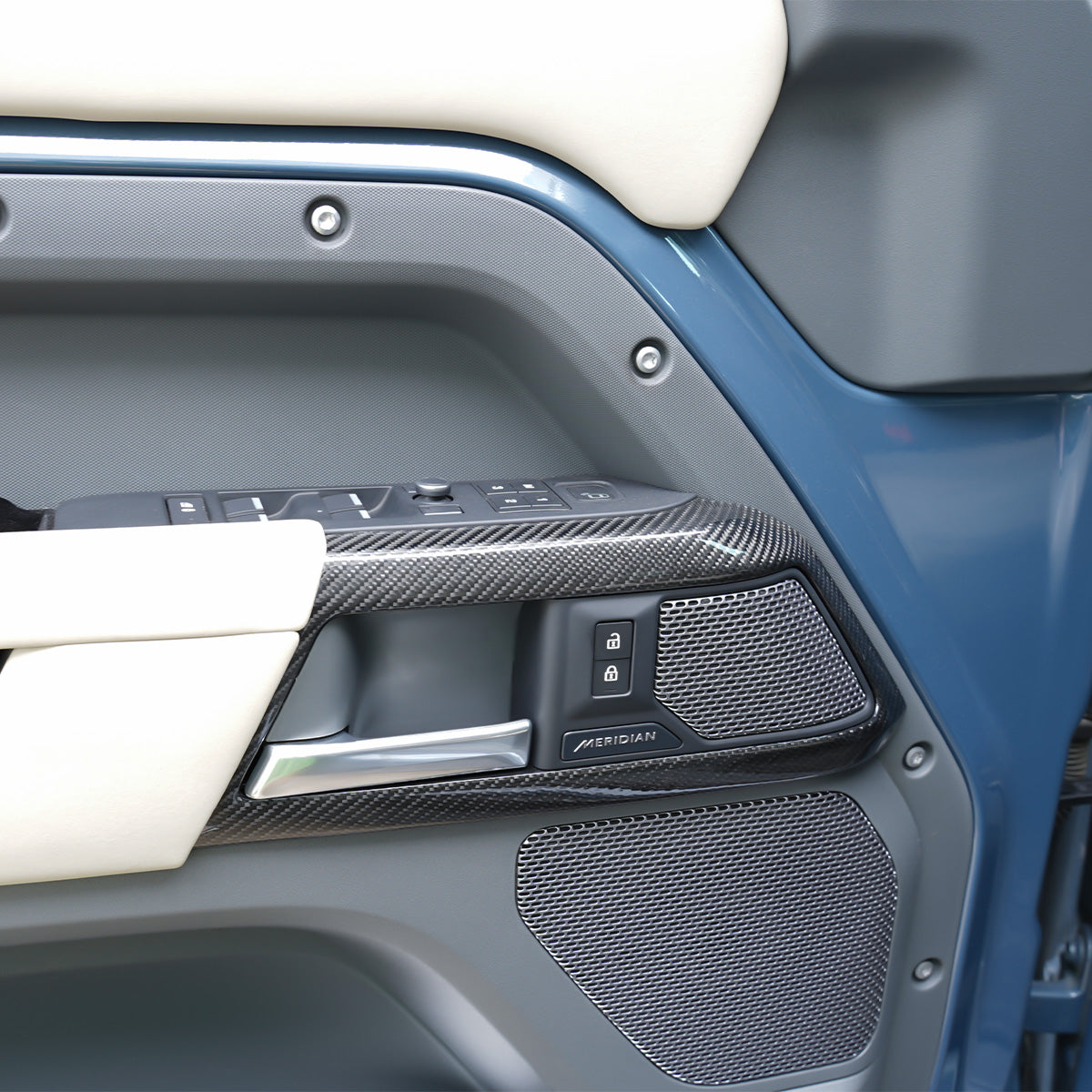 Gloss carbon fiber dashboard trim installed in Land Rover Defender interior