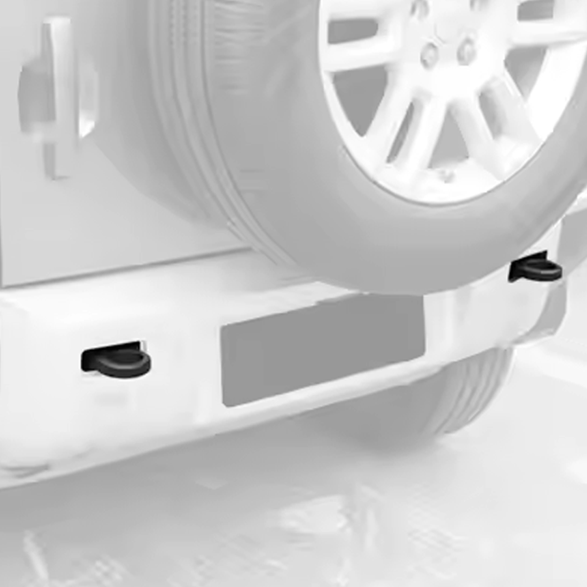 OEM bolt-on aluminium tow hooks installed on Defender L663