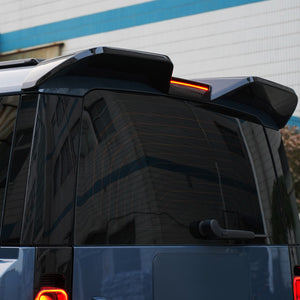 Gloss black roof spoiler installed on Defender L663 premium look