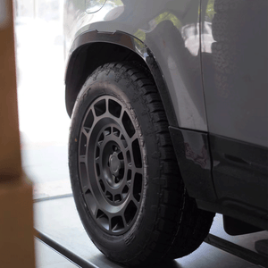 Land Rover Defender OCTA forged wheels installed side profile PLOMOR satin black
