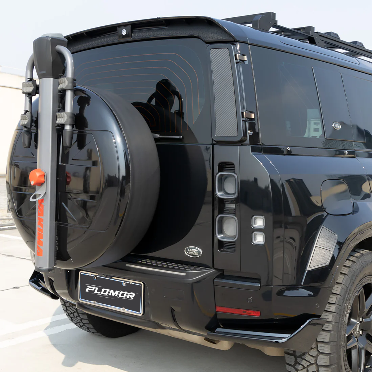 Defender rear roof spoiler installed daylight rear styling OEM finish