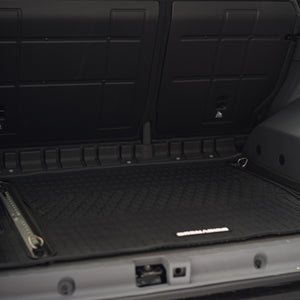 PLOMOR cargo liner in Ineos Grenadier with luggage loading protection