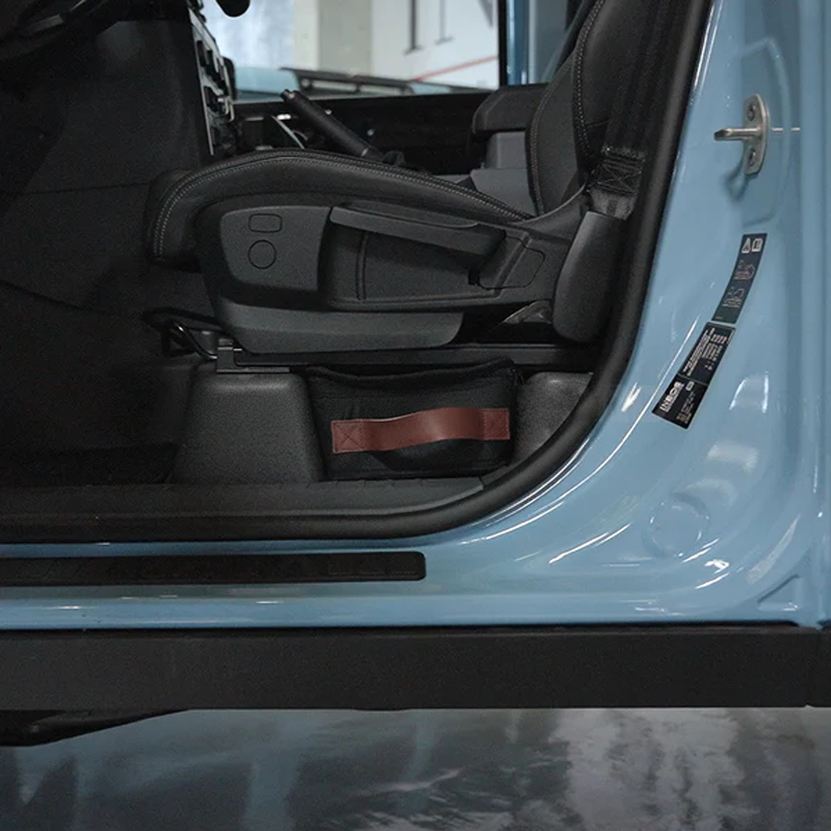 INEOS Grenadier 2020–2024 with under-seat storage organiser installed under the front seat.