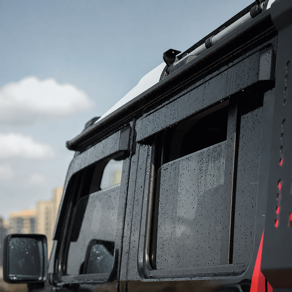 INEOS Grenadier 2023–2025 fitted with PLOMOR 4-piece window deflectors rain guards installed