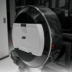 “Black and white spare wheel cover for INEOS Grenadier, weather-resistant design offering durable protection and modern styling.”