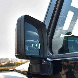 OEM-fit blue wide-angle mirror glass installed on INEOS Grenadier, enhancing rearward visibility and reducing blind spots