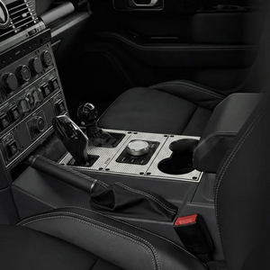 Cup holder fitted in passenger side centre console of INEOS Grenadier 2023+ showing secure fit for larger drinks