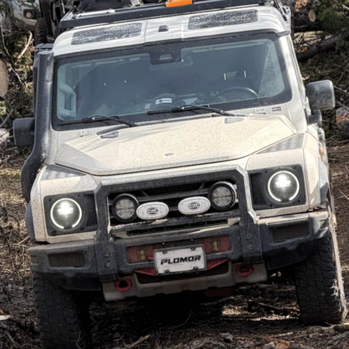 INEOS Grenadier with PLOMOR heavy-duty front bumper during off-road driving