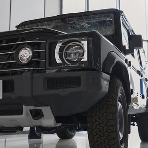 INEOS Grenadier headlight guards installed, showing black aluminium design that protects against debris and minor impacts.