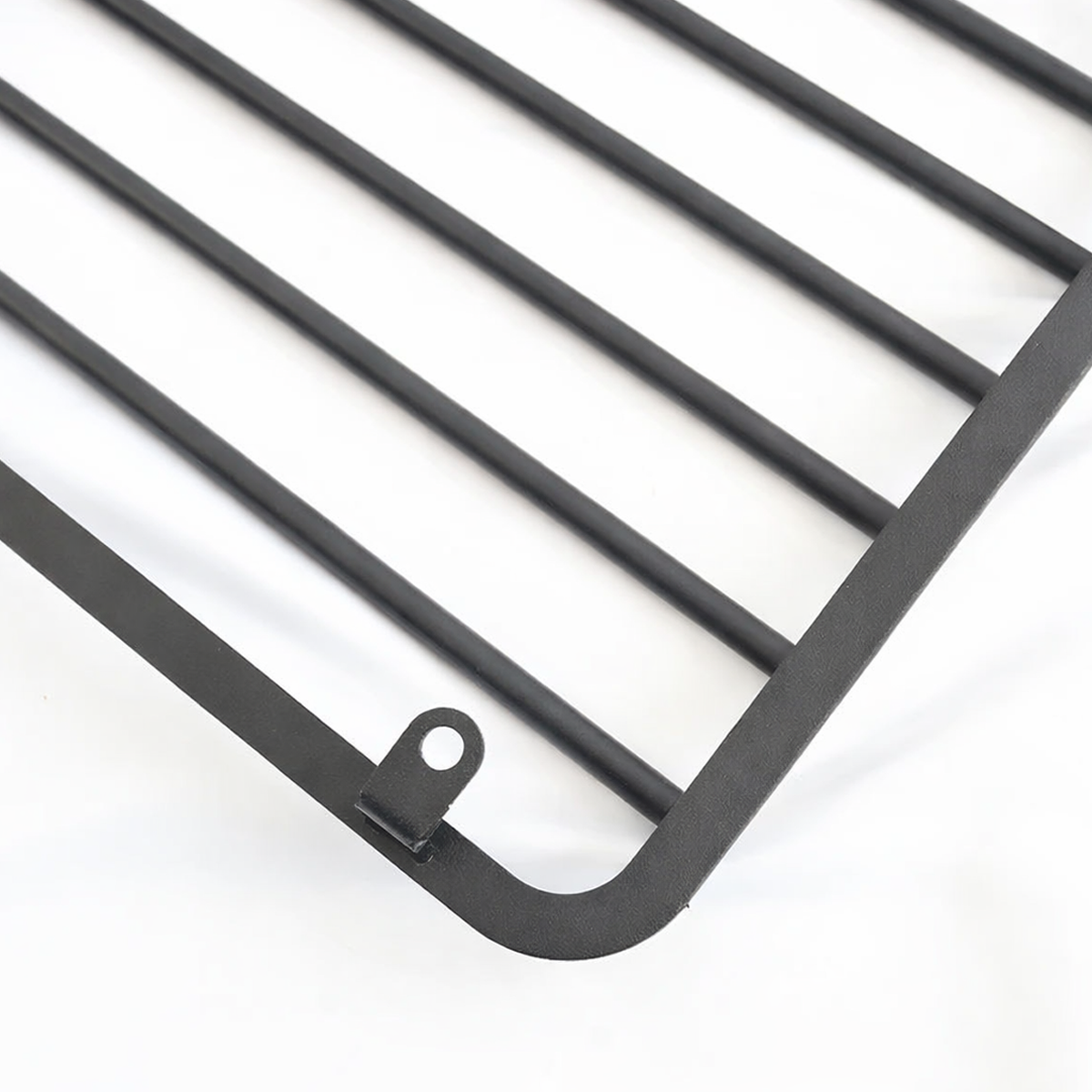 Angled view of INEOS Grenadier metal headlight guard, highlighting rugged design and OEM-style fit