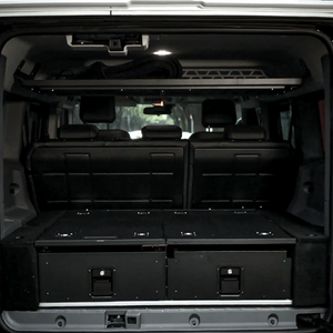 OEM-fit rear trunk drawer system installed in the INEOS Grenadier 2023+, seamlessly integrated with the factory cargo area