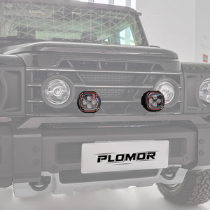 Close-up of dual-function round LED spotlight for INEOS Grenadier showing amber halo ring and LED projector