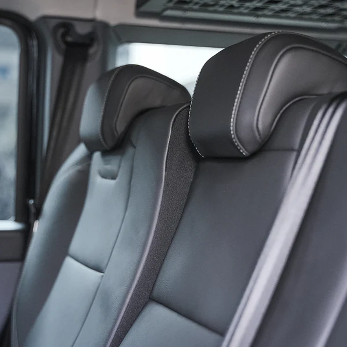 Rear seat recline adjustment bracket installed in INEOS Grenadier improving rear passenger comfort