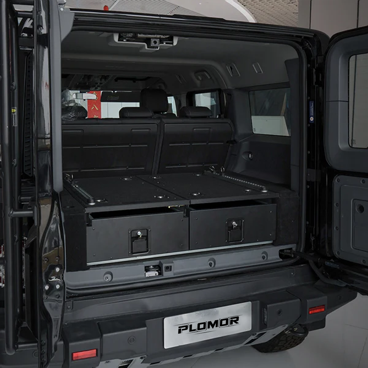 PLOMOR premium rear trunk drawer system installed in the INEOS Grenadier 2023+, delivering organised and secure cargo storage