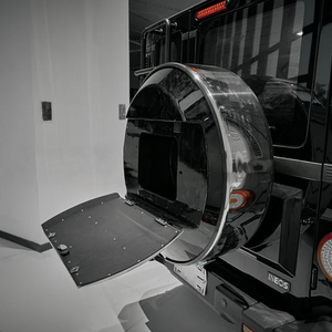 “INEOS Grenadier spare wheel cover installed on rear, weather-resistant protection with modern styling.”