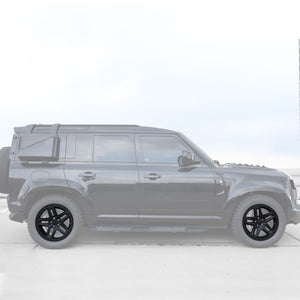 Matte black alloy wheels installed on Defender 110