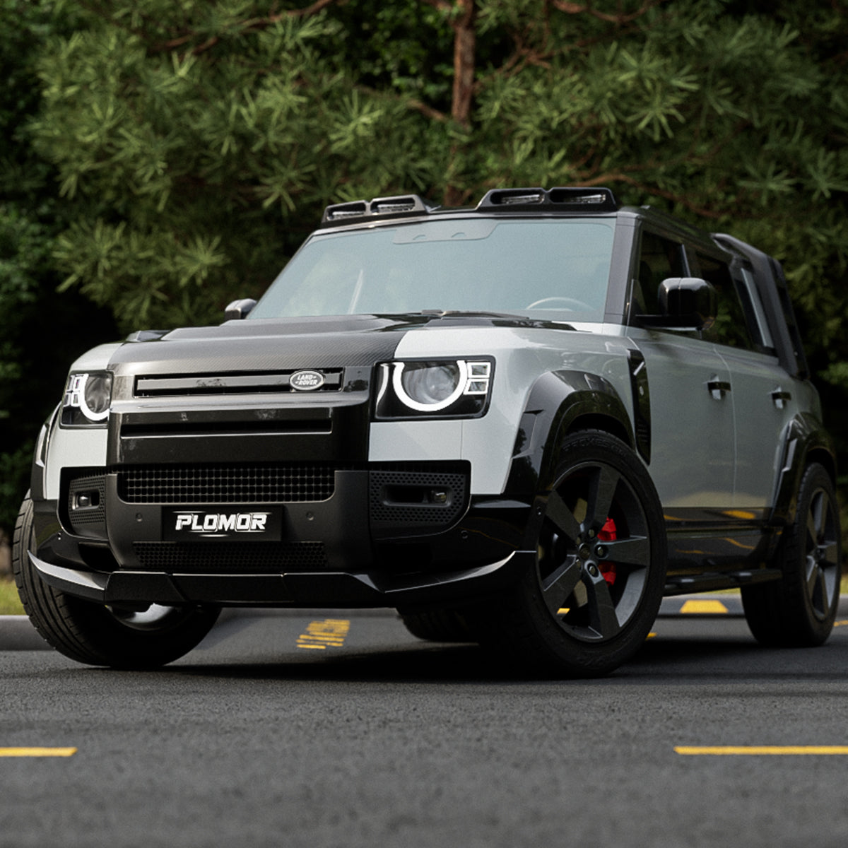 Defender L663 gloss black ABS front lip spoiler detail