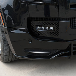 Close-up installed front lip splitter on Defender