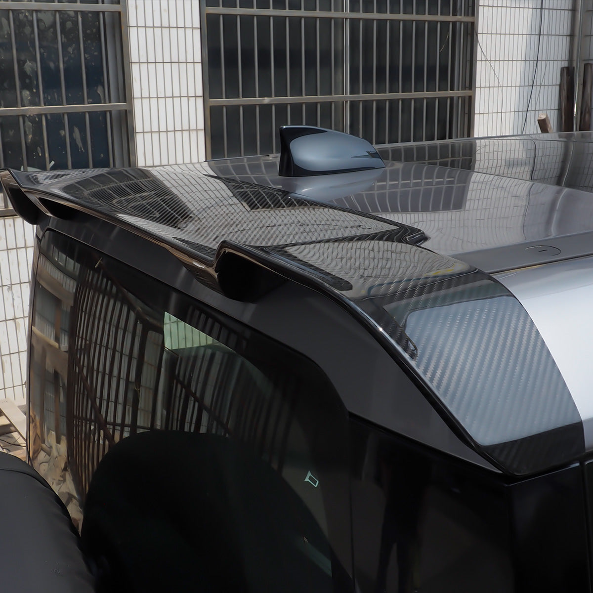 Carbon fibre rear roof spoiler for Land Rover Defender L663 90/110, front view