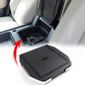 Sliding lid armrest hidden storage compartment for Defender L663