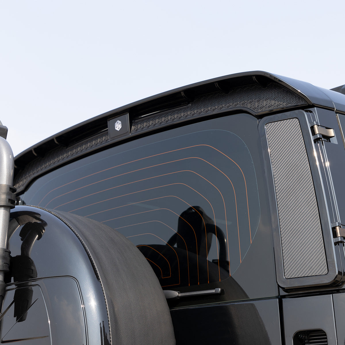 Land Rover Defender rear spoiler installed side angle view aerodynamic upgrade