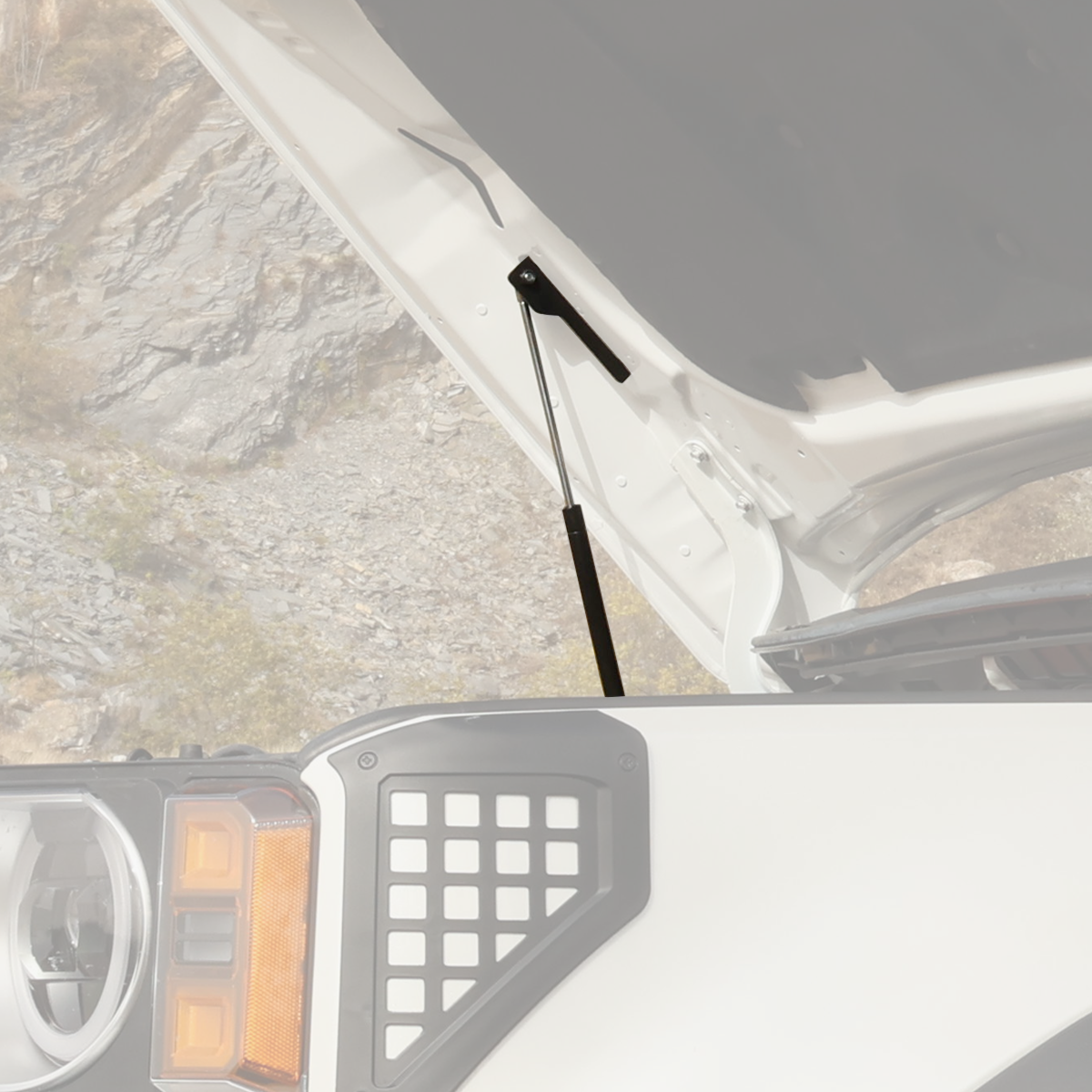 Installed hydraulic hood strut on LC250 showing clean fitment inside the engine bay