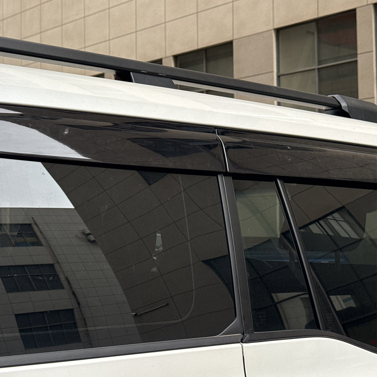 LC250 driving city road with window visors installed rain guards