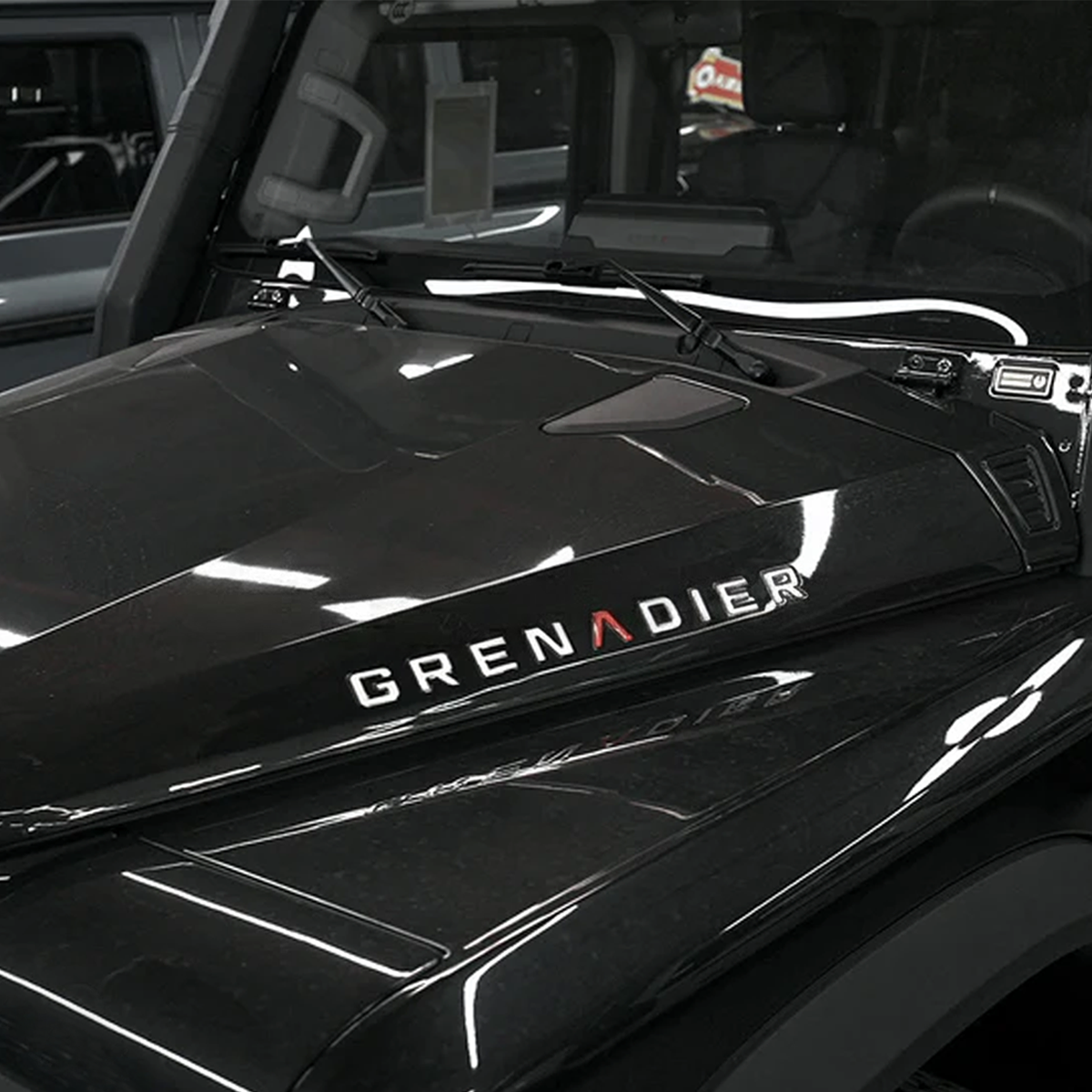 Side perspective showing decals on hood and tailgate, blending seamlessly with vehicle design.