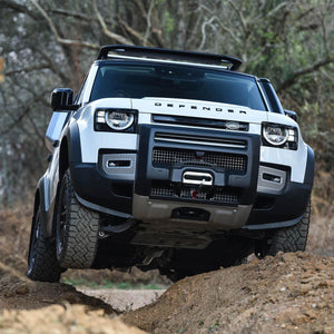 PLOMOR ABS front bumper corner trim installed angled view on Defender