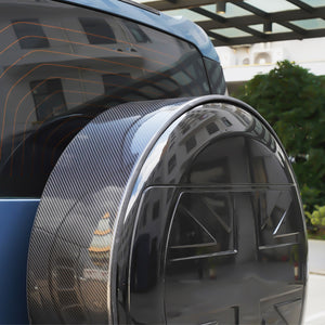 Side view of PLOMOR carbon spare wheel outer ring mounted on Defender 90/110/130 (L663)