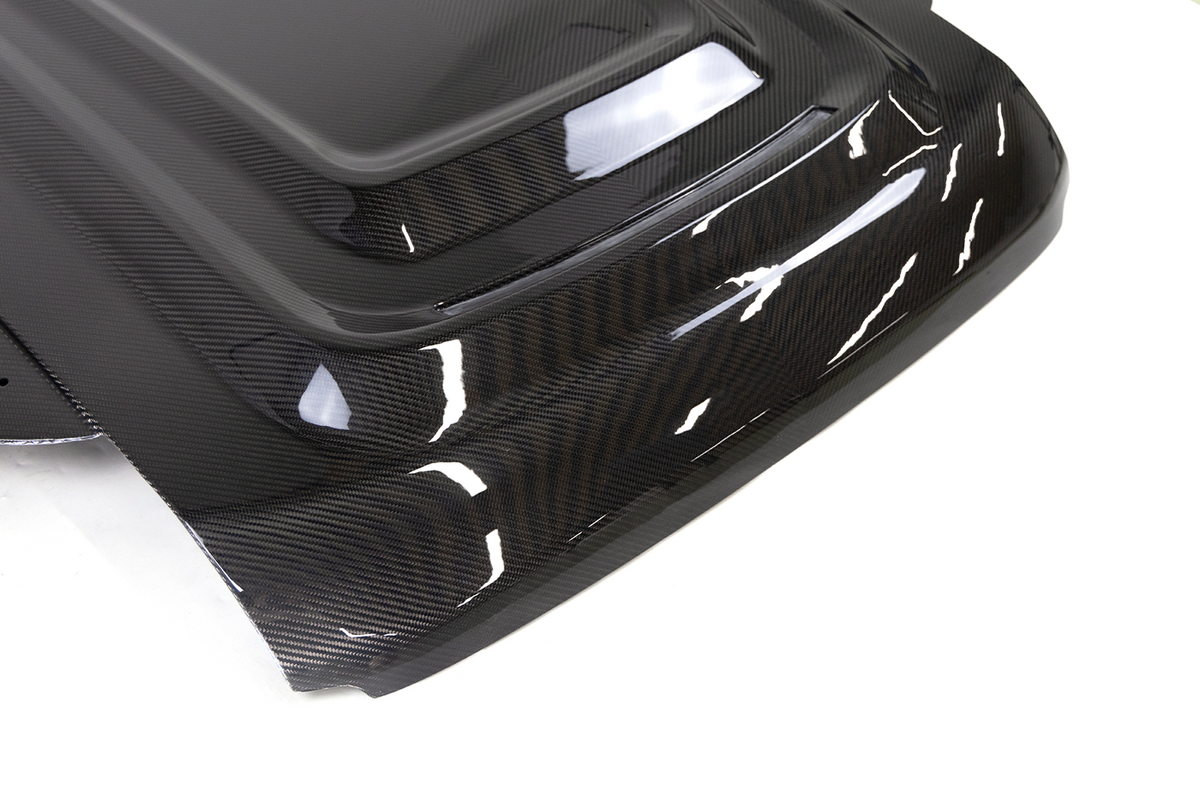 Lightweight Carbon Construction - PLOMOR Dry Carbon Bonnet for Land Rover Defender 90/110/130 (L663) – Lightweight, Glossy & Durable