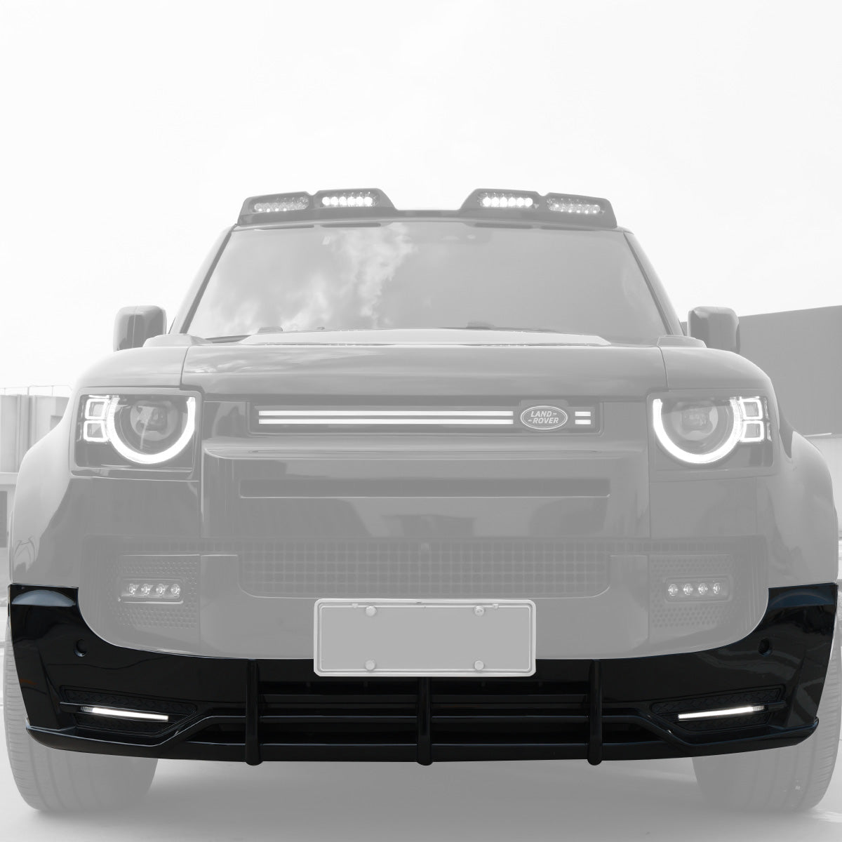PLOMOR front bumper splitter installed on Defender