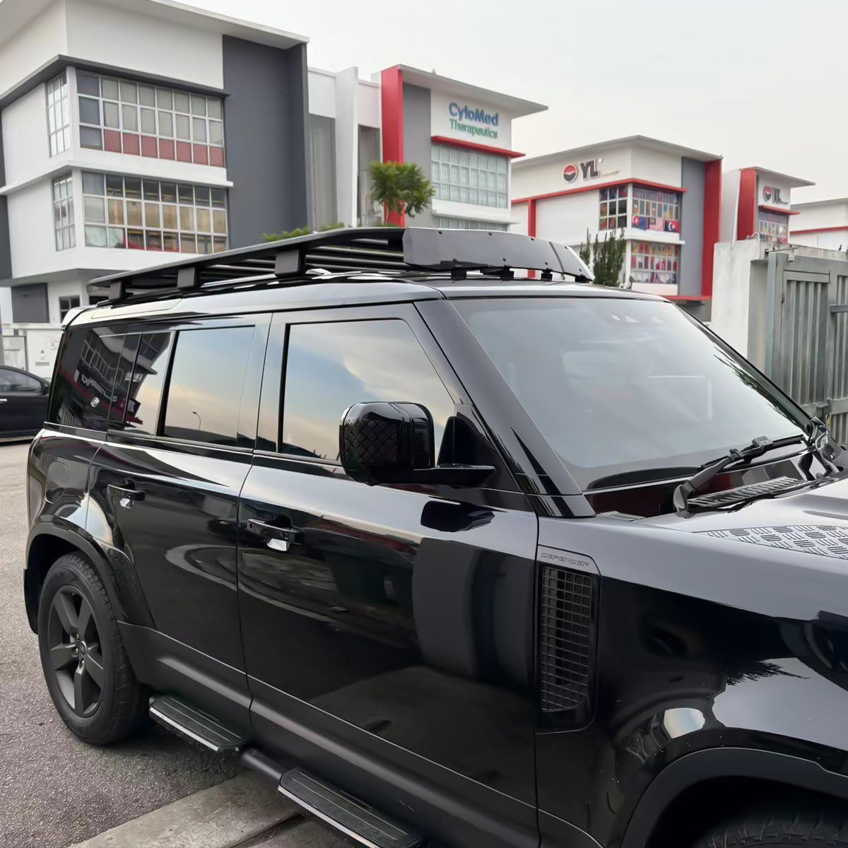 Front and rear view installed gloss black wind deflector