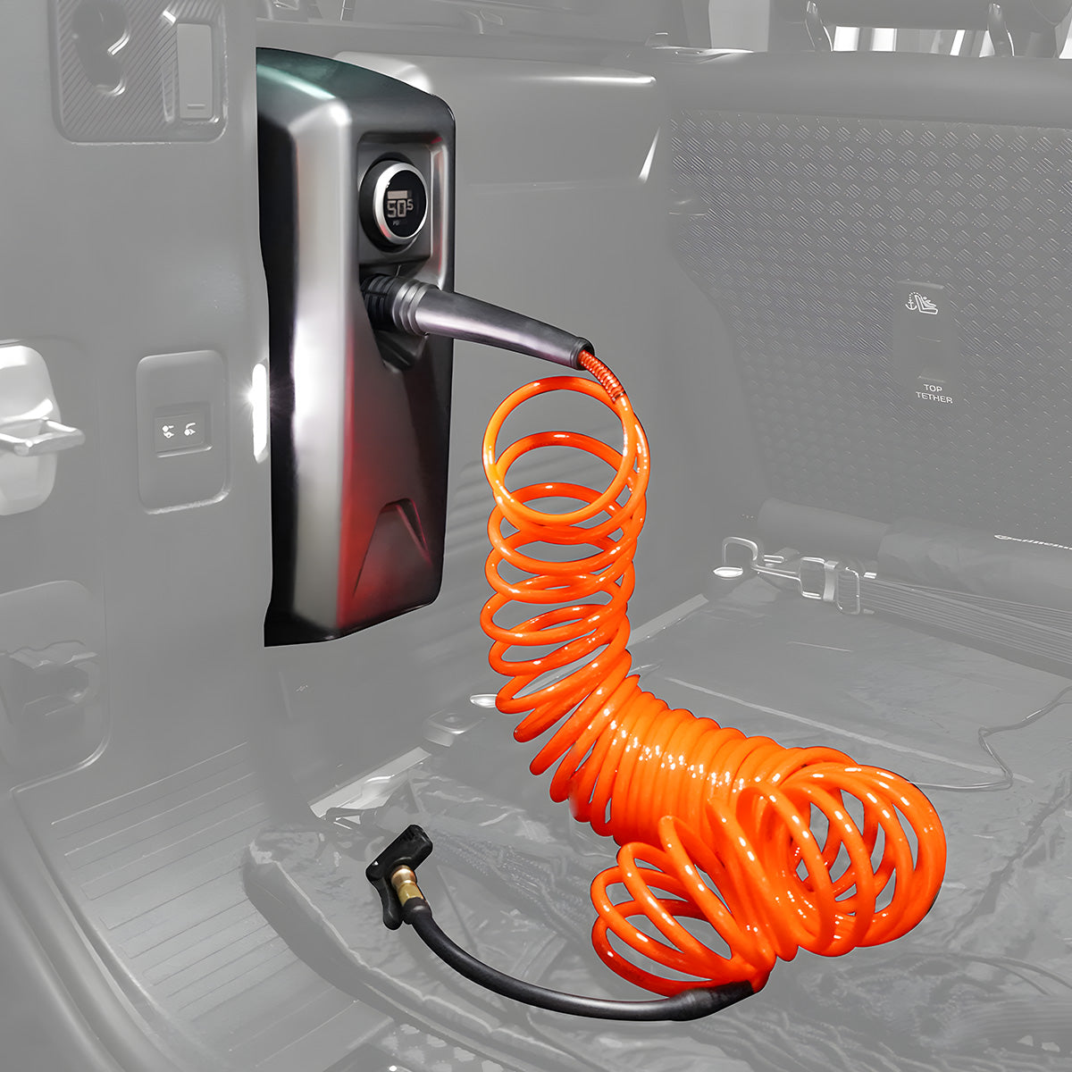 Rear Cargo Area Setup with Tire Inflator – View 